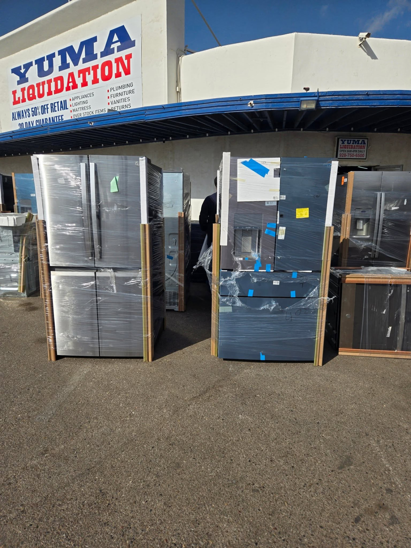 Wrapped refrigerators outside the Yuma Liquidation storefront