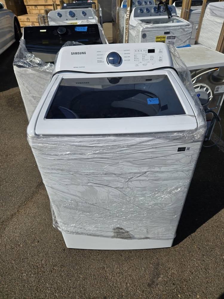 Samsung top-load washer still wrapped in plastic