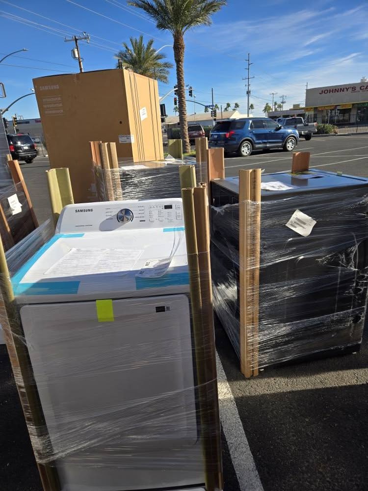 Samsung dryer and appliances wrapped with corner protectors outside