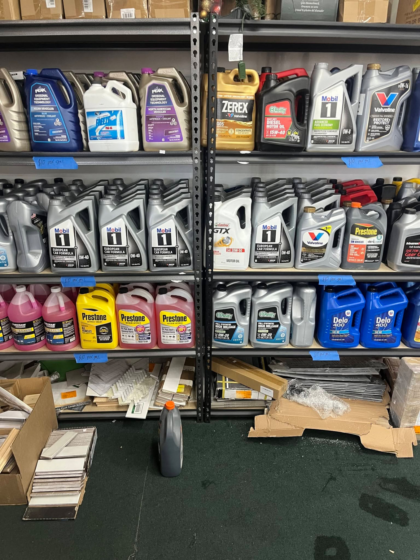 Shelves of motor oil and antifreeze marked $10 per gallon